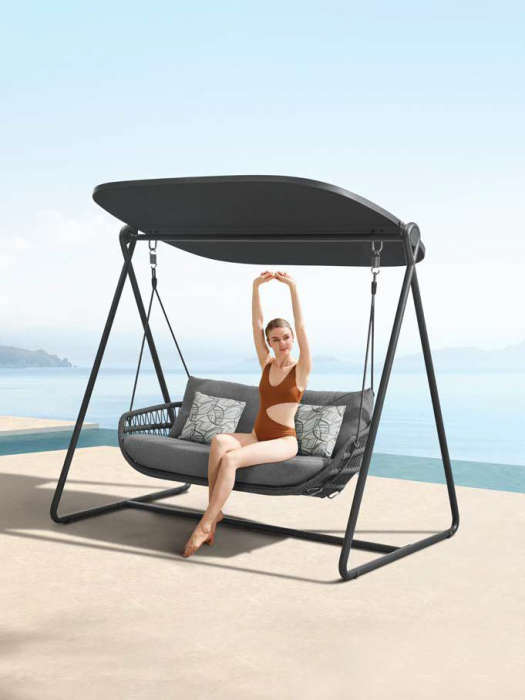 girl sitting on corda swing